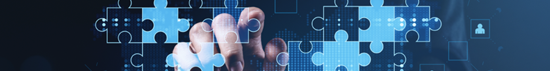 Business professional pointing at tablet with puzzle pieces representing cybersecurity strategy and business objectives