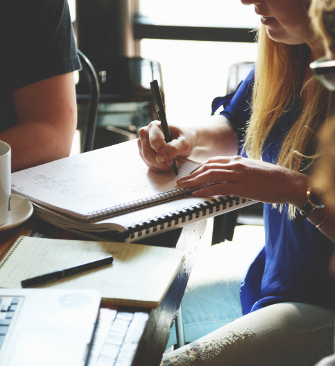 Woman writing down notes
