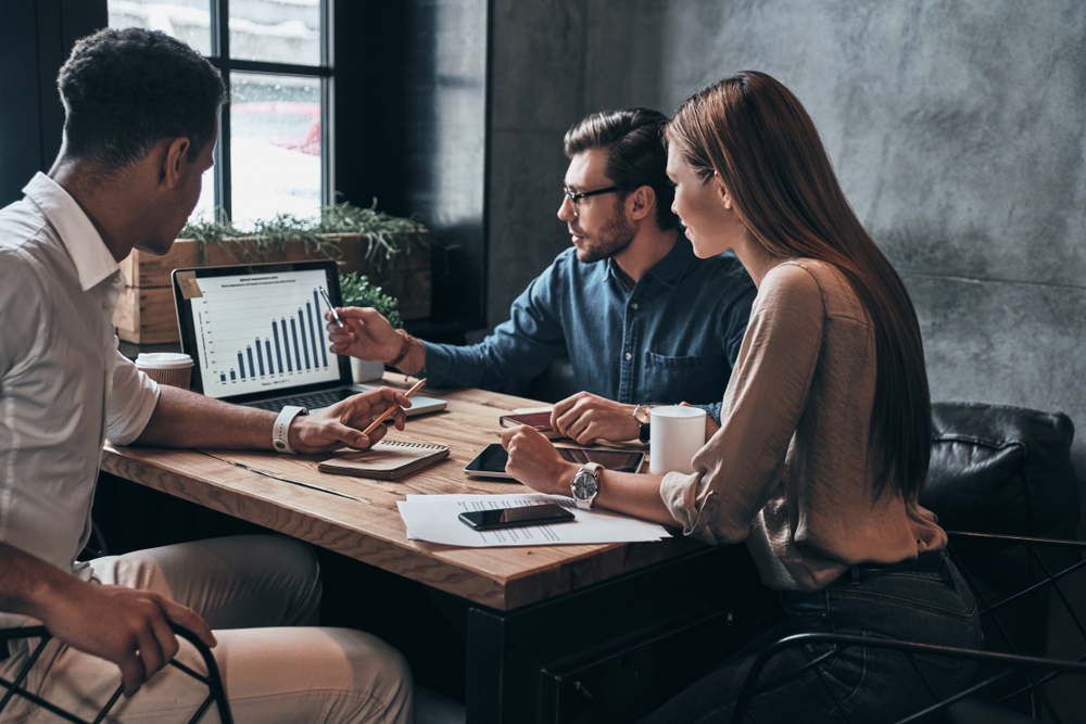 Executives collaborating to build a Cybersecurity Improvement Program