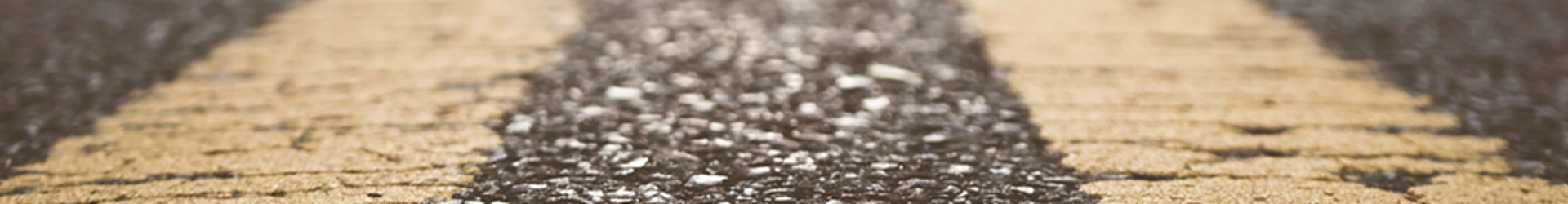 A close up of yellow lines on a city road symbolising the roadmap for a cyber security strategy