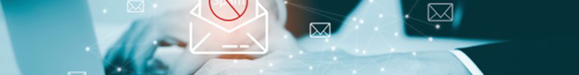 Business man working on a laptop conducting a email security & phishing threat assessment