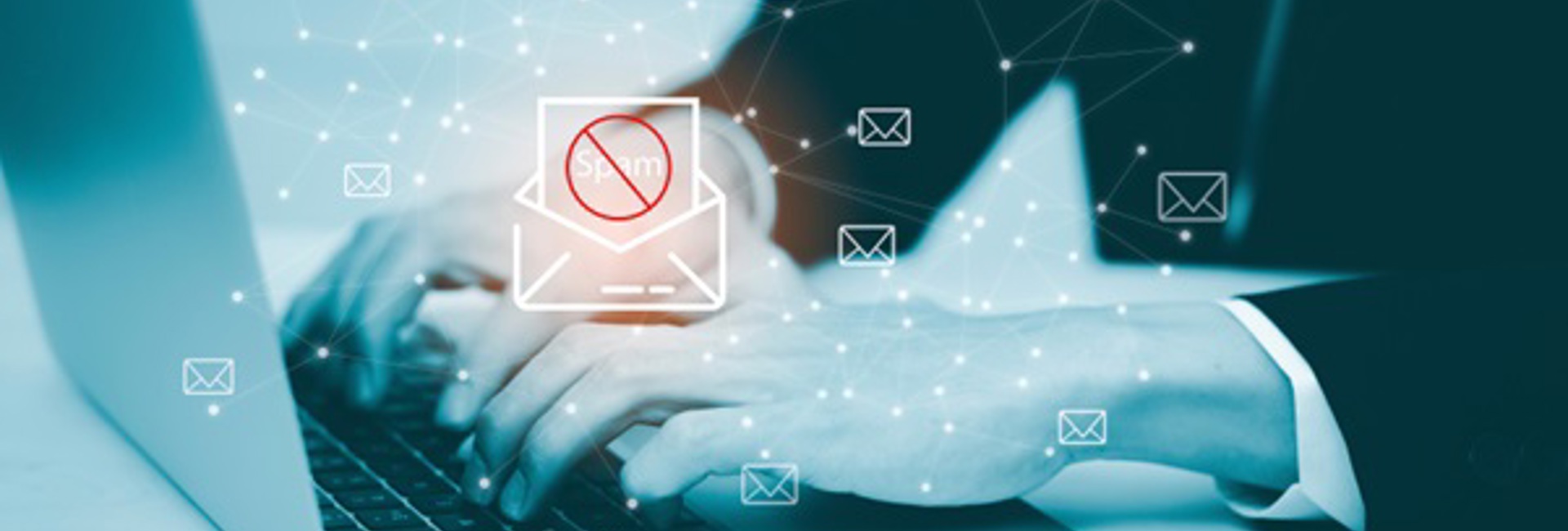 Business man working on a laptop conducting a email security & phishing threat assessment