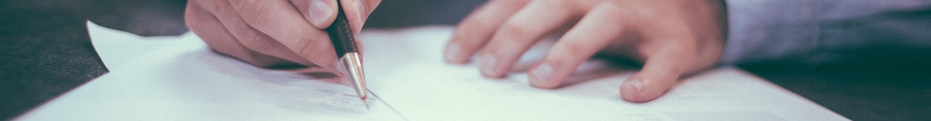 A business man reviewing IT policy paperwork
