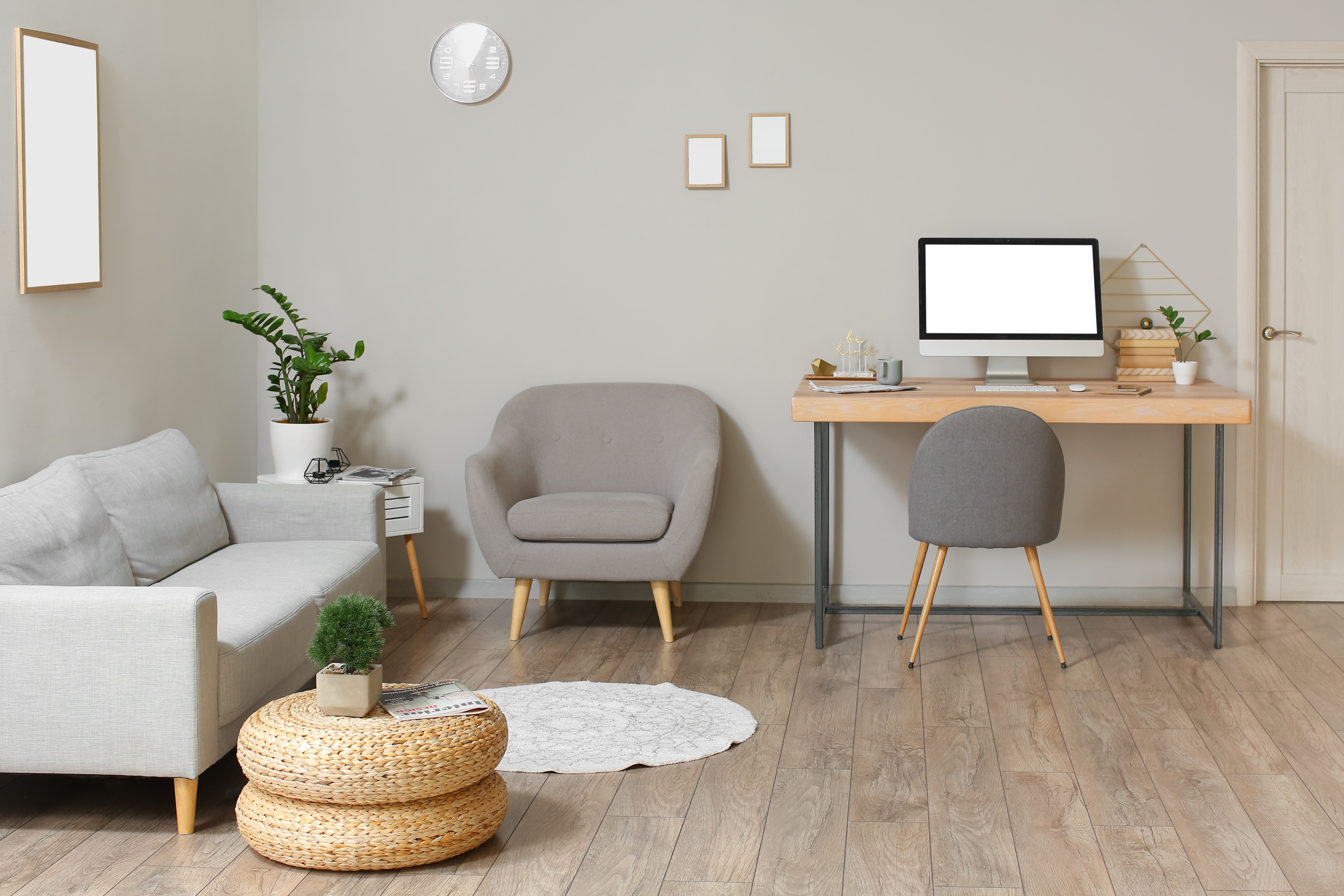 PC on an office desk in a living room home environment for remote working